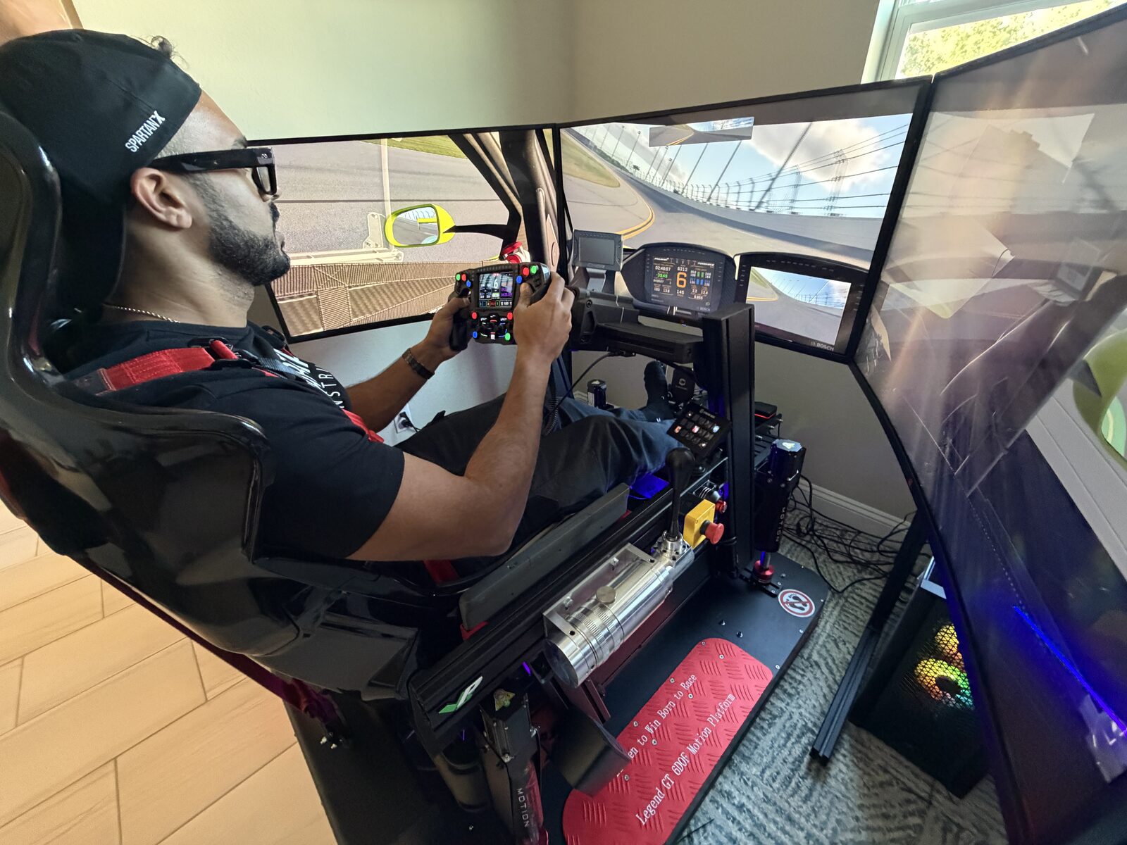 A customer racing on a motion simulator