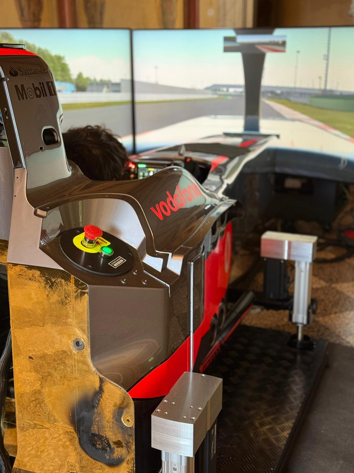 Formula simulator cockpit at speed on the screens