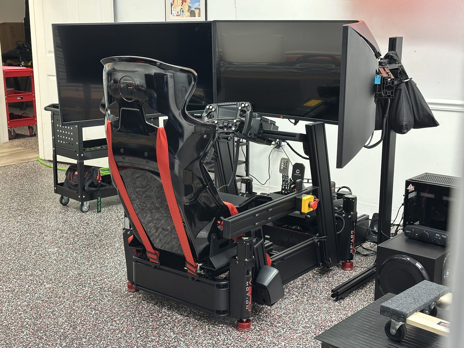 Turn-key racing simulator with triple screens and motion, built by Velocity Pro Sims